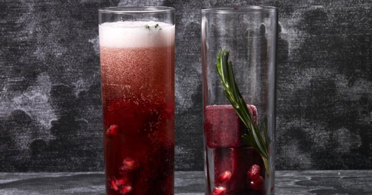 a cokcktail made with blood-red pomegranate for Halloween